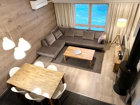 TV and multimedia, Living room, Photo of the whole room, Seating area, Dining area, fireplace, furniture, air conditioner