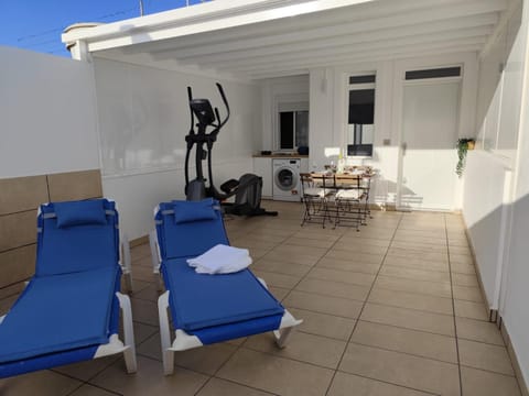 Patio, Balcony/Terrace, Seating area, Dining area, sunbed, towels, washing machine