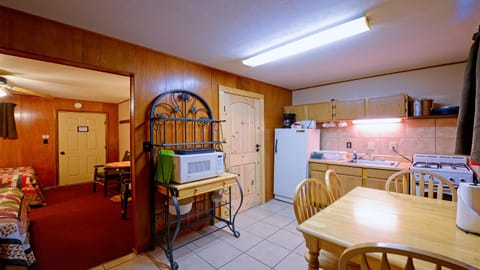 Kitchen or kitchenette, Dining area, Bedroom, furniture, microwave, stove, kitchen, elevator