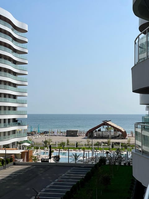Property building, View (from property/room), Balcony/Terrace, Beach, Pool view, Sea view, Swimming pool