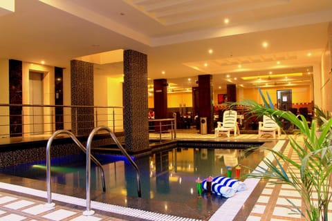 Seating area, Dining area, Text overlay, Swimming pool