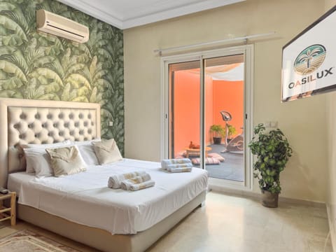 Bed, Photo of the whole room, Bedroom, towels, air conditioner