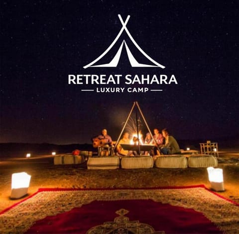 Night, People, Property logo or sign, Natural landscape, Logo/Certificate/Sign, Text overlay, group of guests, Certificate/Award