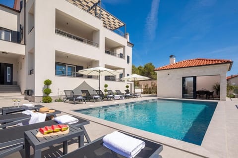 Patio, Day, Pool view, sunbed