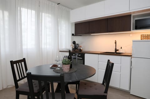 Kitchen or kitchenette, Dining area, dishwasher, microwave, oven, stove
