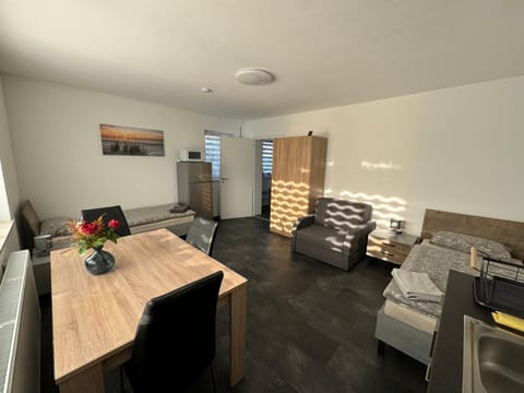 Kitchen or kitchenette, Living room, Seating area, Dining area