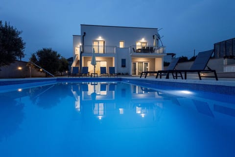 Property building, Night, Pool view, Swimming pool, sunbed