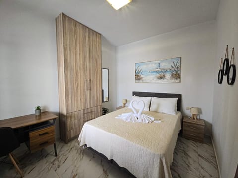 Bed, towels, wardrobe