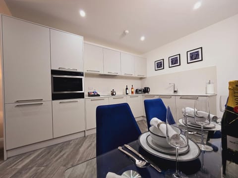 Kitchen or kitchenette, dishwasher, oven, stove, toaster