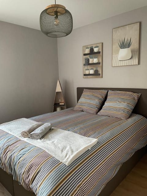Photo of the whole room, Bedroom, flat iron, towels, laundry