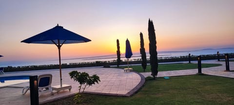 Patio, Day, Natural landscape, Pool view, Sea view, Swimming pool, Sunrise, sunbed