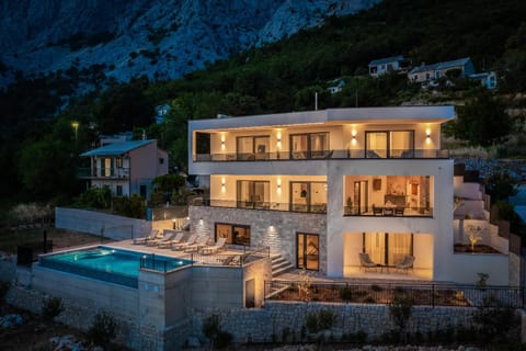 Property building, Night, Natural landscape, Mountain view, Pool view, Swimming pool, sunbed