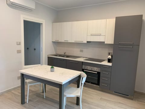 Kitchen or kitchenette, Dining area, oven, stove, air conditioner