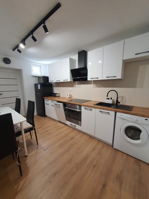 Kitchen or kitchenette, dishwasher, oven, stove, washing machine