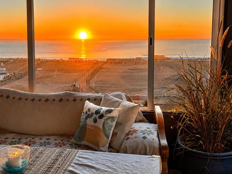 View (from property/room), Living room, Seating area, Sea view, Sunset