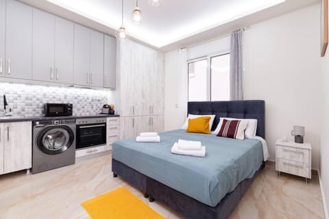 Bed, washing machine, kitchen