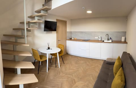 Kitchen or kitchenette, Living room, Seating area, Dining area