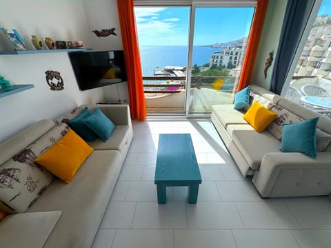 TV and multimedia, View (from property/room), Living room, Seating area, Sea view