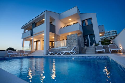 Property building, Patio, Pool view, Swimming pool, sunbed
