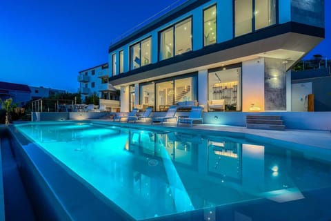 Property building, Night, Pool view, Swimming pool, sunbed
