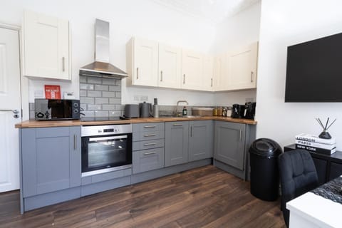 Kitchen or kitchenette, dishwasher, stove, toaster