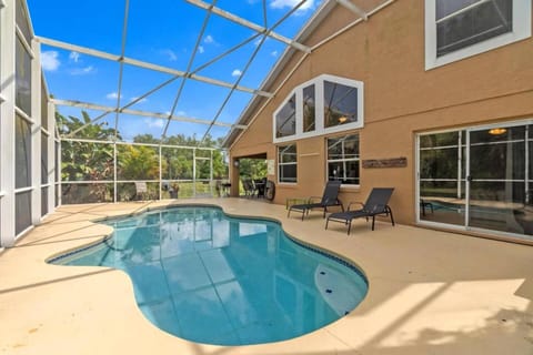 Property building, Patio, Pool view, Swimming pool, sunbed