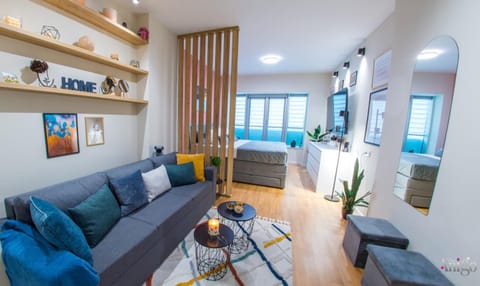 Bed, TV and multimedia, Living room, Seating area, Bedroom