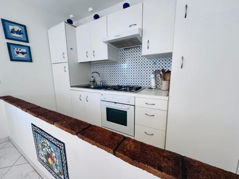 Kitchen or kitchenette, oven, stove