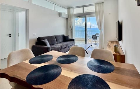 Natural landscape, Living room, Seating area, Dining area, Sea view