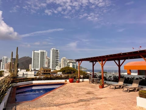 Property building, Day, Natural landscape, Dining area, City view, Pool view, Sea view, Swimming pool, sunbed