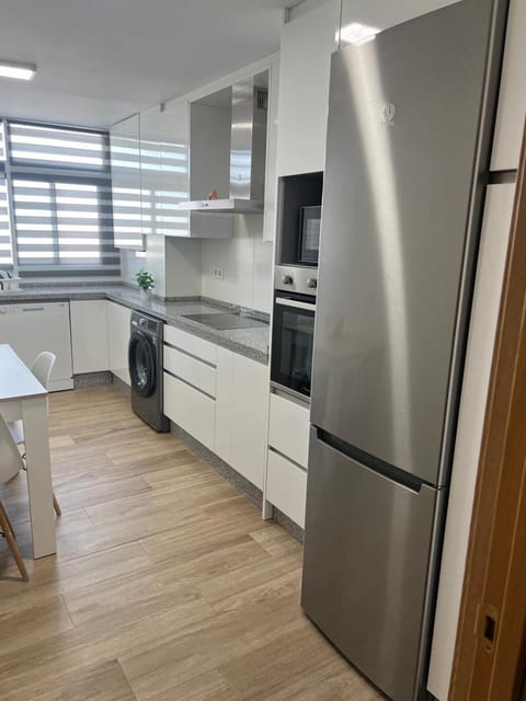 Kitchen or kitchenette, dishwasher, oven, stove