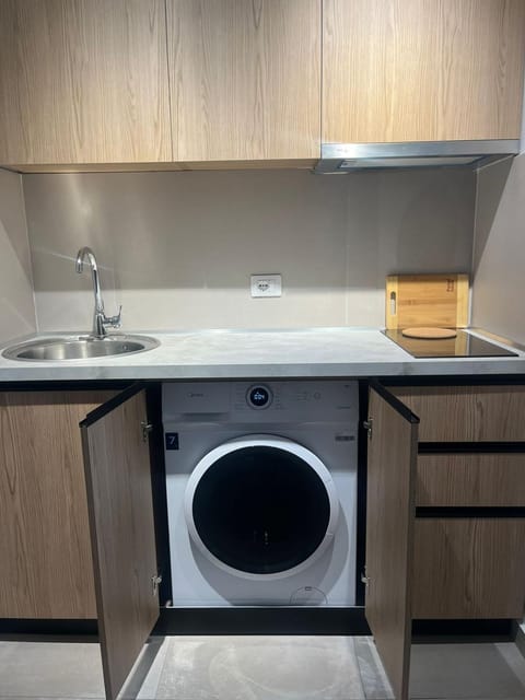 Kitchen or kitchenette, washing machine