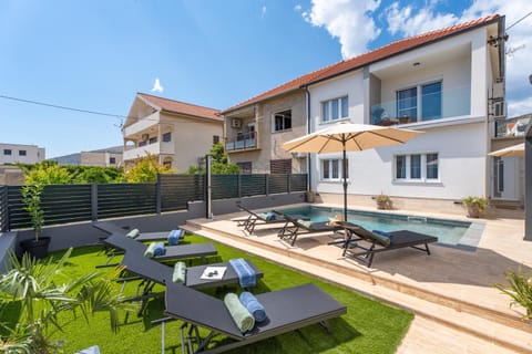 Property building, Patio, Garden, Seating area, Garden view, Pool view, Swimming pool, sunbed