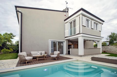 Patio, Seating area, Swimming pool, sunbed