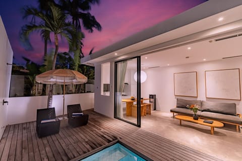 Patio, Night, View (from property/room), Balcony/Terrace, Living room, Seating area, Pool view, Swimming pool, sunbed