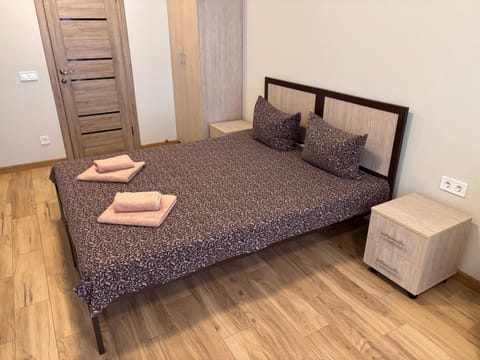 Bed, towels, wardrobe