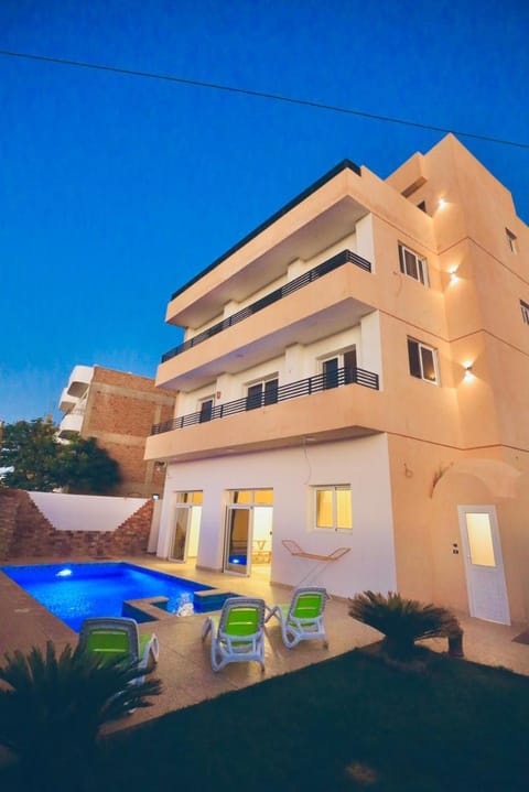 Property building, Patio, Swimming pool, sunbed