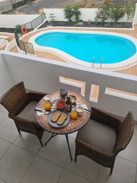 View (from property/room), Balcony/Terrace, Pool view, Swimming pool