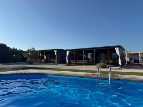 Property building, Day, Pool view, Swimming pool, sunbed