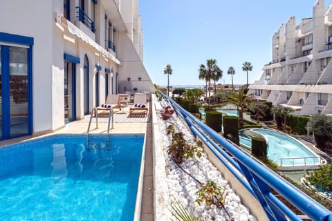 Property building, Day, Pool view, Swimming pool, sunbed