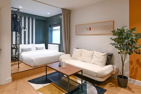 Bed, Living room, Seating area, Bedroom