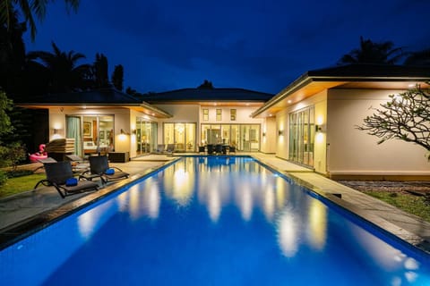 Property building, Patio, Night, Pool view, Swimming pool, sunbed