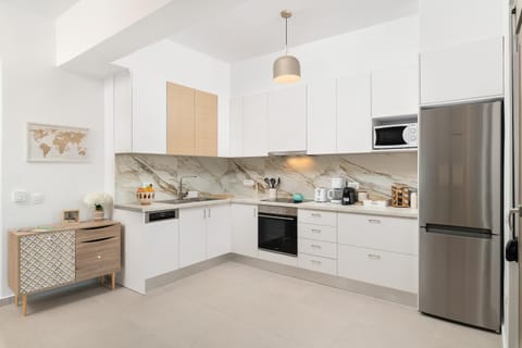 Kitchen or kitchenette, dishwasher, oven, stove