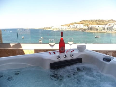 DuplexPenthouse seafront with hot tub by Homely Apartment in Saint Paul's Bay