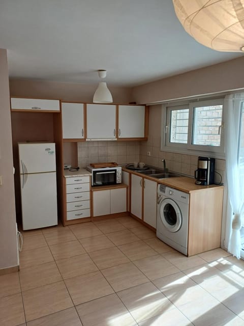 Kitchen or kitchenette, stove, washing machine