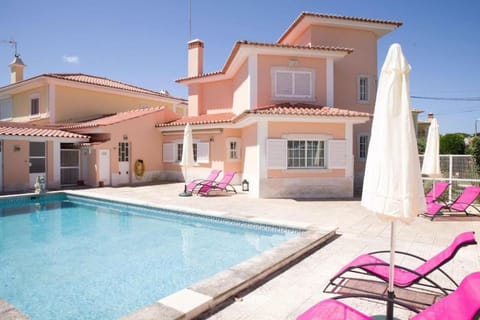 Property building, Patio, Pool view, Swimming pool, sunbed