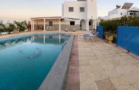 Property building, Pool view, Swimming pool, sunbed