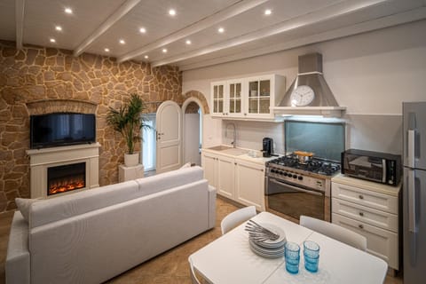 TV and multimedia, Coffee/tea facilities, Kitchen or kitchenette, Living room, Seating area, dishwasher, stove