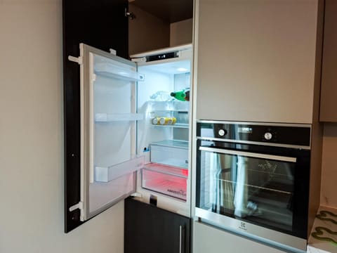 Kitchen or kitchenette, dishwasher, oven, stove