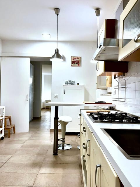 Kitchen or kitchenette, dishwasher, oven, stove